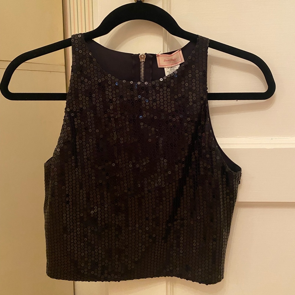 Love…ady black sequin crop too with leather back! Perfect for New Year’s Eve